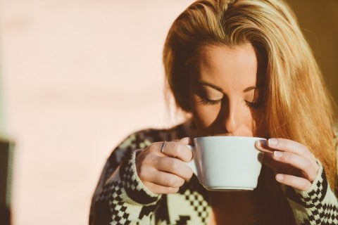 Woman drinks coffee