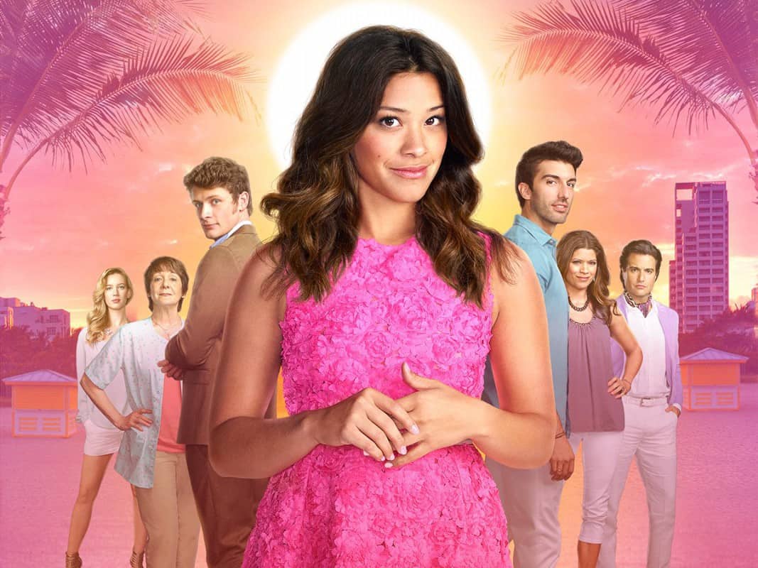 Jane the virgin cast in front of a pink backdrop