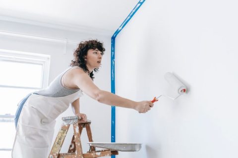 Woman painting home